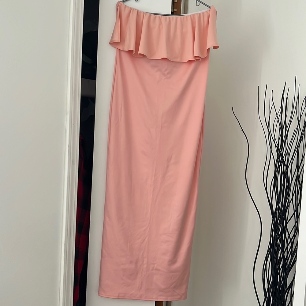 Maxi strapless dress with raffle in front. Never been worn. New with no tag